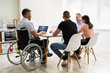 Disabled People In Wheelchair At Workplace
