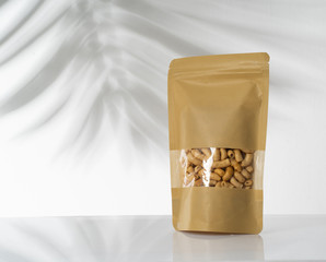 Wall Mural - peanut snack on a blank standing pouch mockup with transparent window