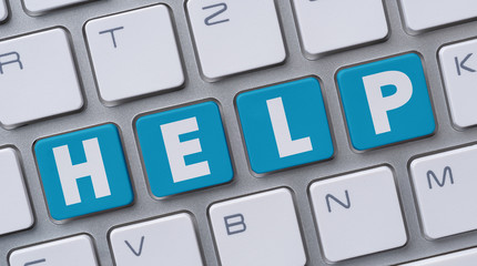 Wall Mural - a computer keyboard with the word help
