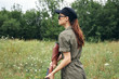 © SHOTPRIME STUDIO - Military woman with a gun hunting green overalls green leaves green