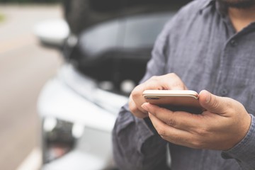  man using smart phone for help.concept car service.