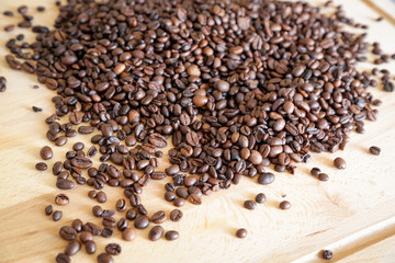 Wall Mural - Coffee grains on wooden table, with natural light