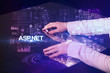 © ra2 studio - Businessman touching huge display with ASP.NET inscription, modern technology concept