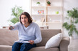 © Elnur - Young male student preparing for exams at home