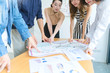© whyframeshot - topview of creative agency business brain storm meeting presentation Team discussing roadmap to product launch, presentation, planning, strategy, new business development