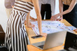 © whyframeshot - topview of creative agency business brain storm meeting presentation Team discussing roadmap to product launch, presentation, planning, strategy, new business development