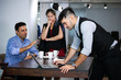 © torsakh - Group of Business people or team meeting in office and colleague relaxing talking or discussion and fun happy with coffee