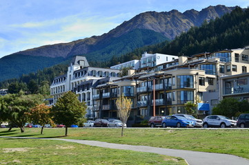 Garden Queenstown With house and car park and mountain background