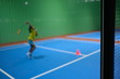 © Missleestocker - Blur background with little girl training class badminton at  gym.