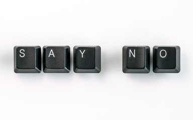 Wall Mural - Computer keyboard keys spelling Say No, isolated on white background