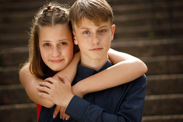 Poster - young couple hugging on a romantic date in summer