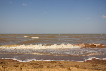 Close-up of sand on the beach and water of the Yarovoe salt lake (Altai Territory).