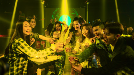 group of young people have fun enjoy party and dancing in night club