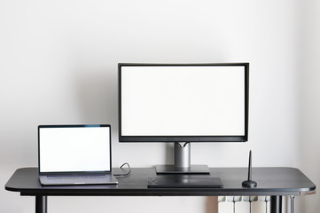 Desk with laptop and computer monitor