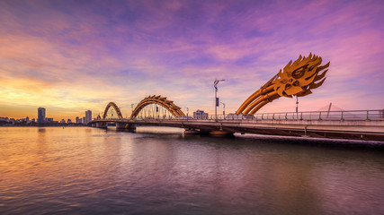 dragon bridge at sunset which is considered as the icon of da nang city, vietnam. near golden bridge