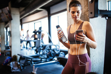 Wall Mural - Close up image of attractive fit woman in gym