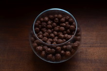 Breakfast. Chocolate Balls From Cocoa In A Beautiful Transparent Glass On A Dark Background.