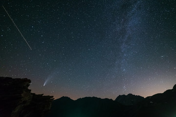Wall Mural - comet neowise twin tails glowing in the night sky. telephoto view, details of the two star trails. o