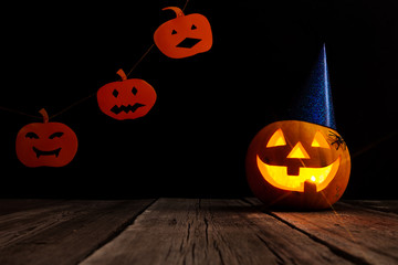 Halloween pumpkin head jack lantern on wooden background