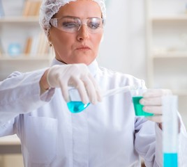 Woman chemist working in hospital clinic lab