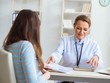 © Elnur - Woman visiting female doctor for regular check-up
