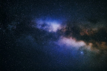 Wall Mural - a saturated night sky with stars. the milky way galaxy on a long exposure
