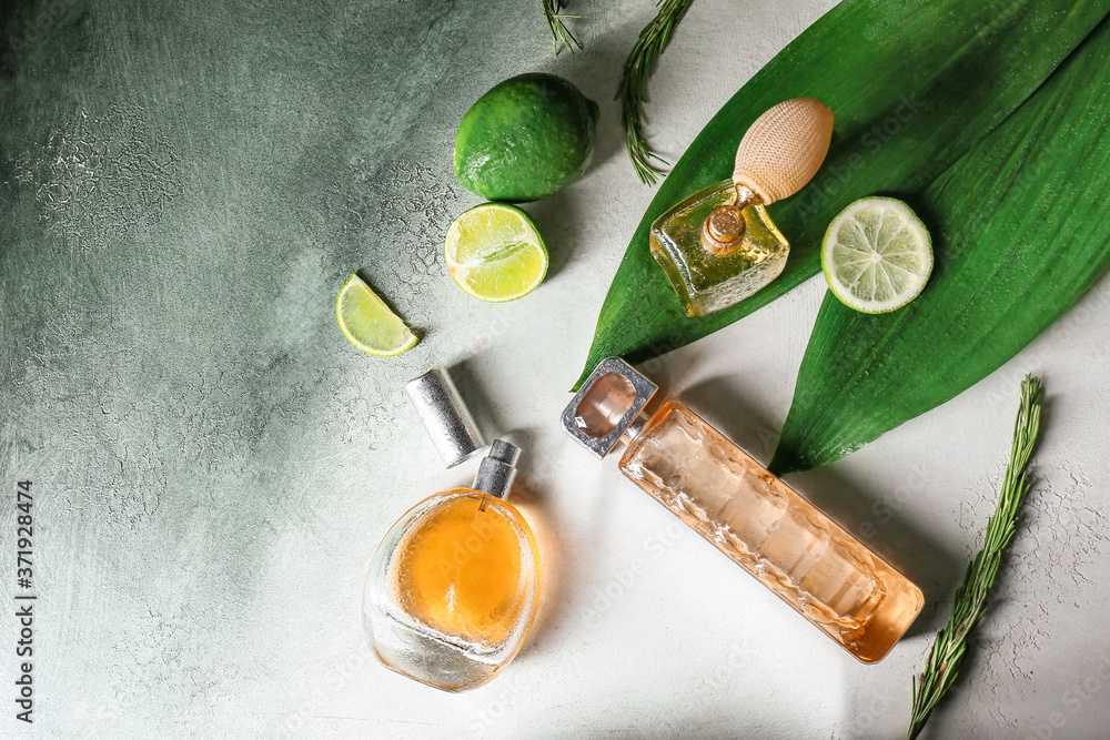 Bottles of citrus perfumes on table