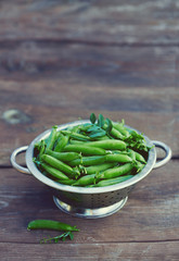 Sticker - fresh green peas on wooden surface