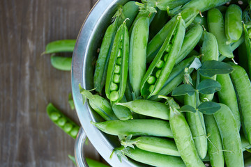 Sticker - fresh green peas on wooden surface