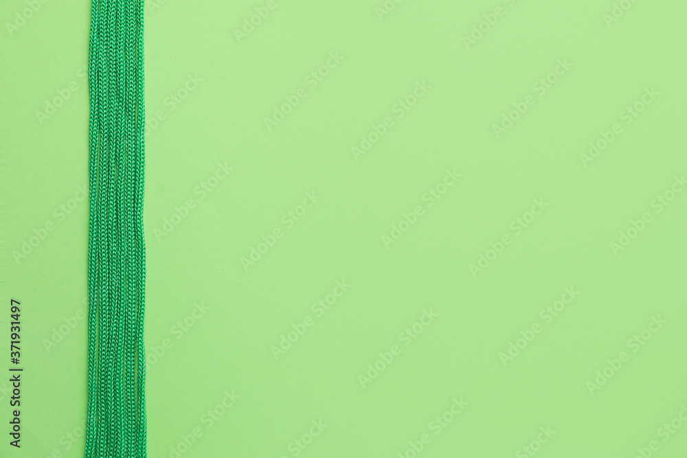 Long ropes on color background