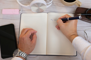 Poster - Businessman using a smartphone and working on the table