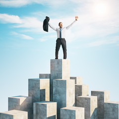 Poster - Happy businessman standing on cube