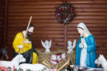 Wall Mural - Mary with Joseph and baby Jesus,Christmas Nativity Scene Jesus in the hay with angels and parents