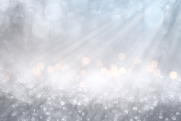 bokeh effects on silver glittering background white bokeh effects on blue and silver glittering abst
