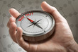 © Olivier Le Moal - Crisis exit strategy or plan. Man holding a conceptual compass.