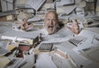 © stokkete - Screaming businessman drowning under a lot of paperwork