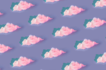 Wall Mural - pattern made of clouds of cotton wool in holographic neoon colors on pastel purple background. cyber