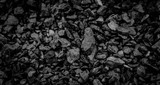 Fototapeta  - Coal Mine. Natural black coals for background. Industrial coals. Volcanic rock energy on earth. Stone Natural Energy Source.