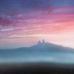 Poster - Ruins of old castle Trosky in Bohemian Paradise, Czech Republic. Ruins consist of two devasted towers on the woody hill. Morning landscape with misty atmosphere