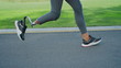 © stockbusters - Woman with prosthetic leg running on road. Female sportsperson training outdoors
