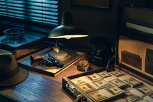 Film Noir Style Desktop With Revolver And Cash Money