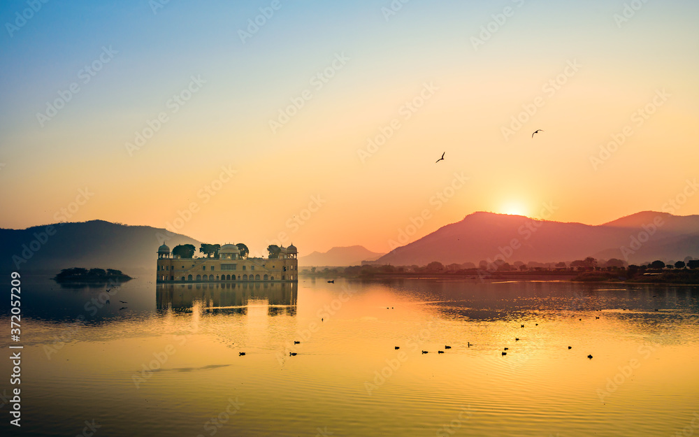 Panoramic view during Sunrise at the Jal Mahal 'Water Palace'. It is an ...