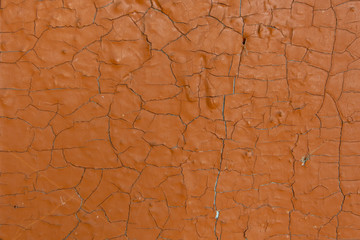 Texture of cracked brown paint close-up, old painted surface