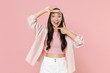 © ViDi Studio - Excited young asian woman girl in casual clothes cap posing isolated on pastel pink wall background studio portrait. People lifestyle concept. Mock up copy space. Making hands photo frame gesture.
