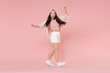 © ViDi Studio - Full length portrait of excited young asian girl in casual clothes, cap isolated on pink wall background studio portrait. People lifestyle concept. Mock up copy space. Dancing, spreading rising hands.