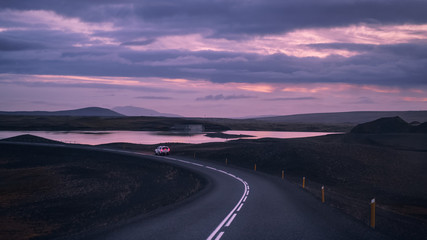 Iceland roads. Travel nature landscape. Drive on the road at sunset