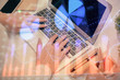 © peshkova - Multi exposure of woman hands typing on computer and forex chart hologram drawing. Stock market analysis concept.