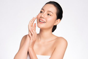 beautiful young asian woman with clean fresh skin, on white background, face care, facial treatment,