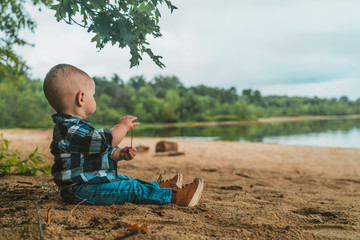 little boy playing on the beach