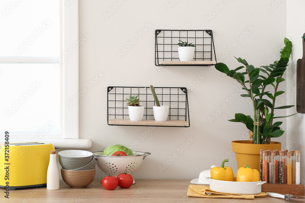 Set of utensils and products on kitchen counter